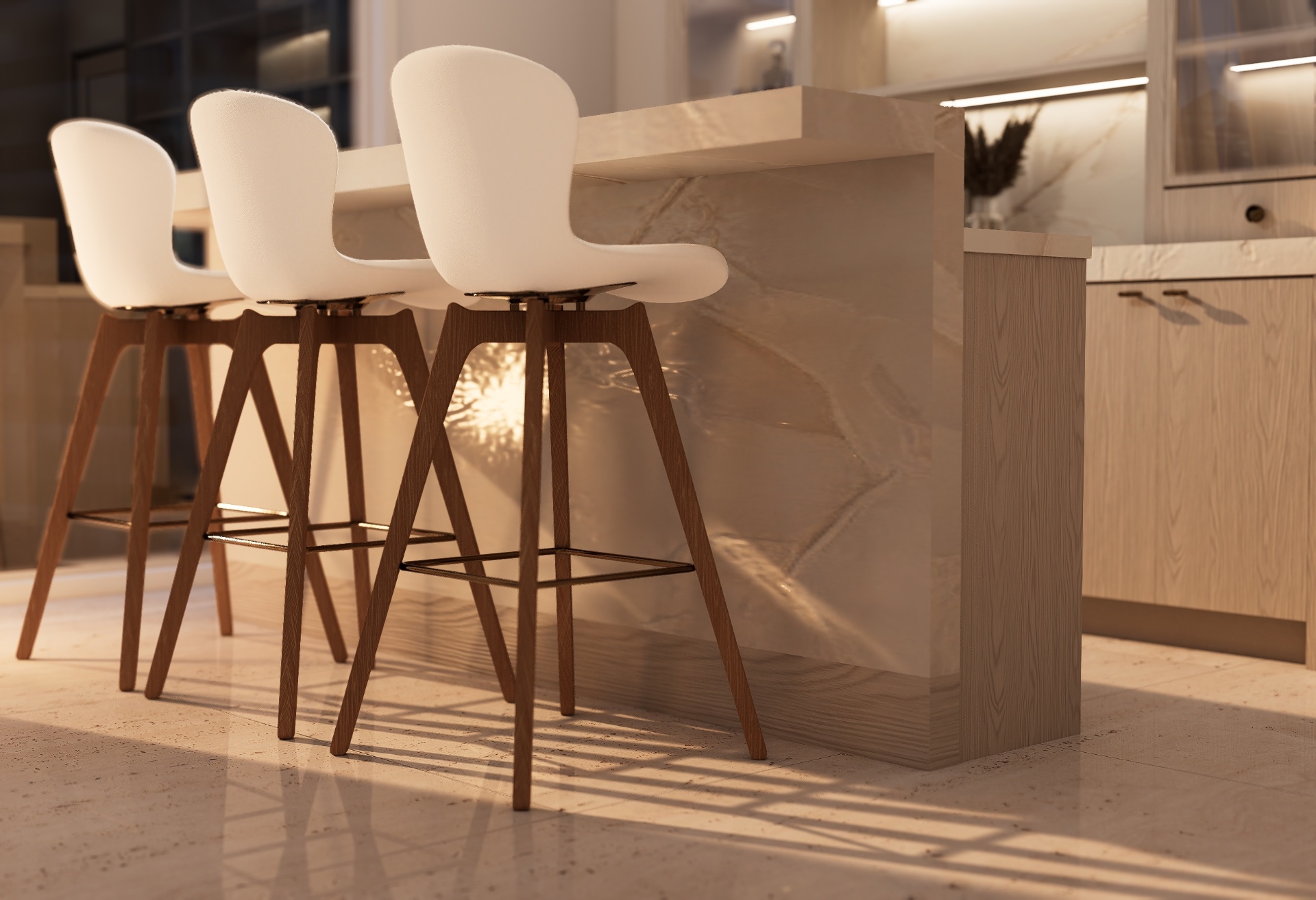 Back-of-island detail showing marble waterfall edge and white bar stools