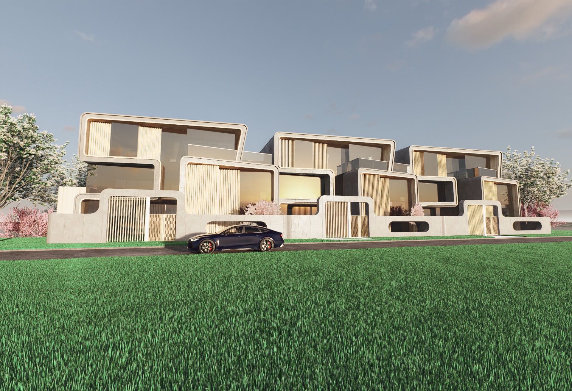 Street-facing view of the residences with sculptural concrete façades and grass lawn